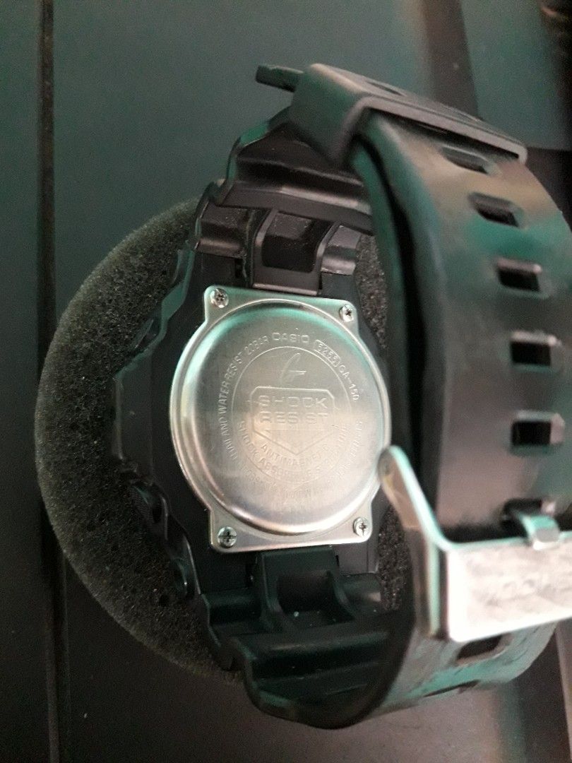 Casio G-Shock GA-150 Analog-Digital Watch (Category: Men's Watches) located in Paranaque City. Submitted by omaraguirre (Listing ID 1469778486, Image 2). Description: - Brand: Casio G-Shock - Model: GA-150 (All Black) - Display: Combo analog hands and digital screens - Durability: Shock resistant, 200M water resistant, and anti-magnetic - Strap: Black resin with silver-toned buckle - Condition: Pre-owned with minor daily wear marks on the band an