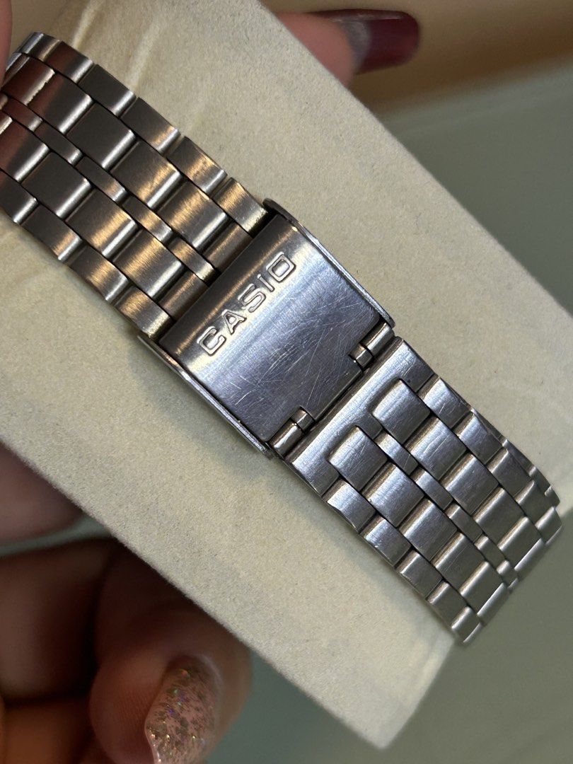 Casio Quartz Silver Analog Stainless Steel Watch (Category: Men's Watches) located in Cavite. Submitted by mamamia73 (Listing ID 1469901303, Image 2). Description: - Brand: Casio Classic Quartz - Dial: Silver with minimalist stick markers and day-date display - Material: Water-resistant stainless steel case and metal link bracelet - Condition: Good overall shape, keeps time reliably, with normal hairline scratches on the clasp from regular wear -