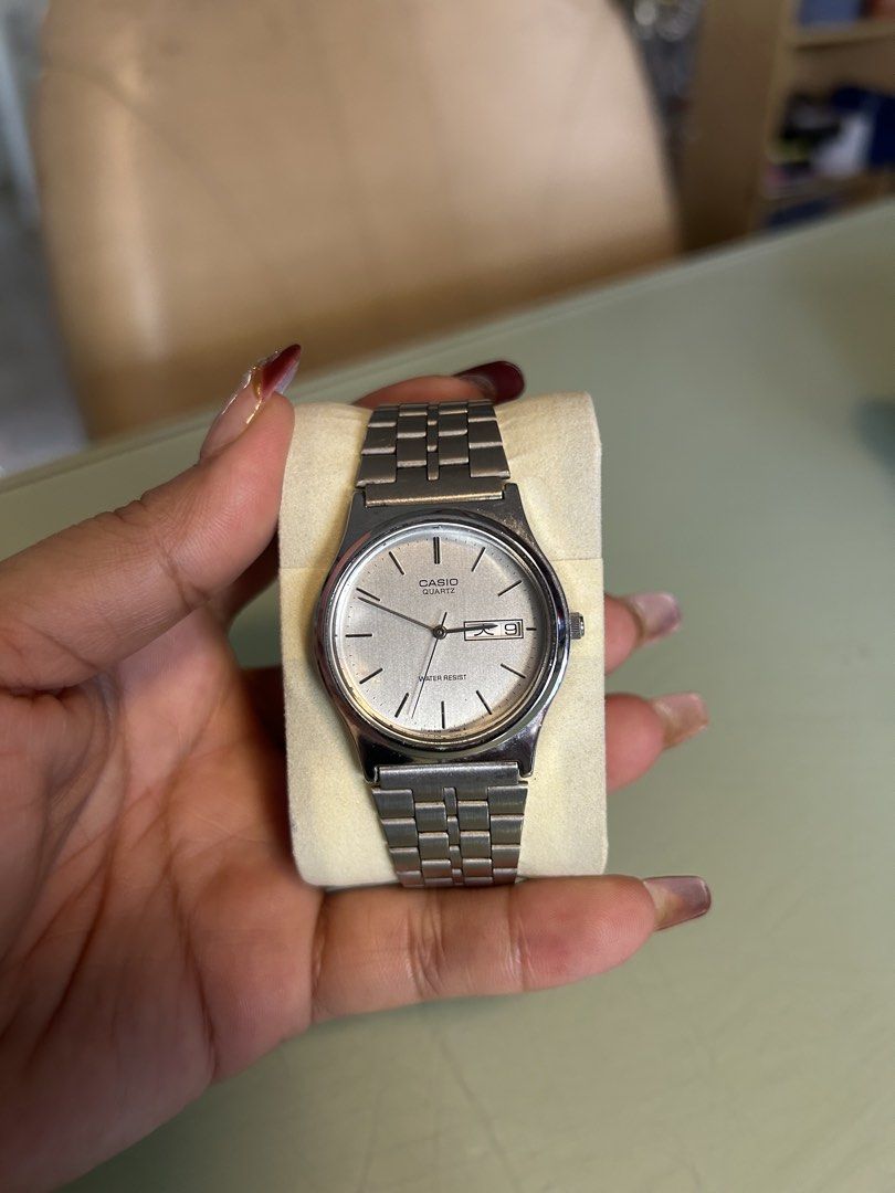 Casio Quartz Silver Analog Stainless Steel Watch (Category: Men's Watches) located in Cavite. Submitted by mamamia73 (Listing ID 1469901303, Image 1). Description: - Brand: Casio Classic Quartz - Dial: Silver with minimalist stick markers and day-date display - Material: Water-resistant stainless steel case and metal link bracelet - Condition: Good overall shape, keeps time reliably, with normal hairline scratches on the clasp from regular wear -