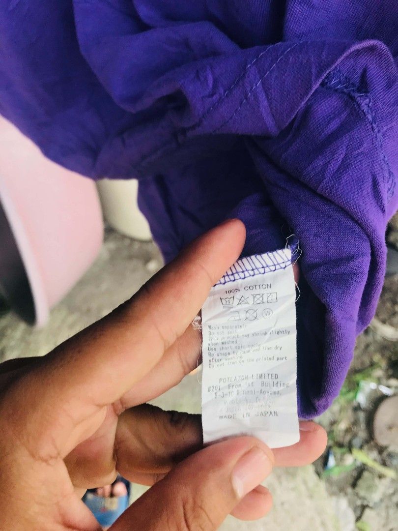 Cav Empt C.E Purple Graphic Tee Made in Japan (Category: Tshirts & Polo Shirts ) located in Camiling. Submitted by akosiano (Listing ID 1469839855, Image 3). Description: - Brand: Cav Empt - Color: Purple - Size: S - Material: 100% Cotton - Origin: Made in Japan - Features: Unique graphic prints on front and back - Condition: Wash tag clearly attached with care instructions.