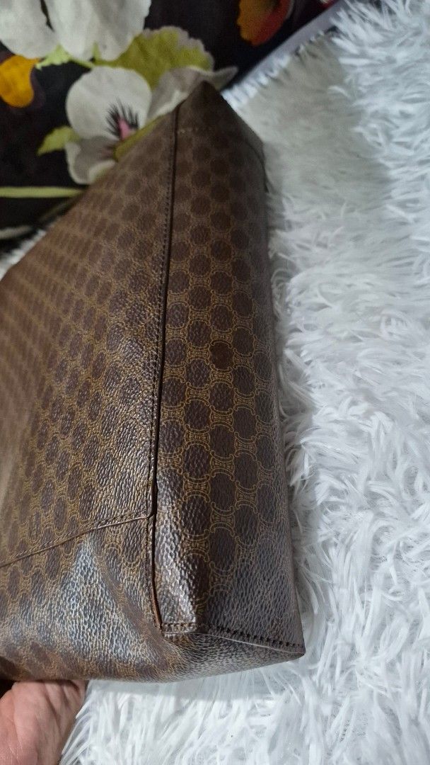 Celine Brown Macadam Monogram Leather Tote Bag (Category: Luxury Bags & Wallets) located in Baguio. Submitted by jhaz_bags (Listing ID 1469934442, Image 2). Description: - Authentic Celine tote in classic brown Macadam monogram coated canvas - Elegant tan leather trim and sturdy dual top handles - Features embossed Celine lettering at the base - Divided interior with a secure center zip compartment - Clean dark brown lining - Perfect everyday siz