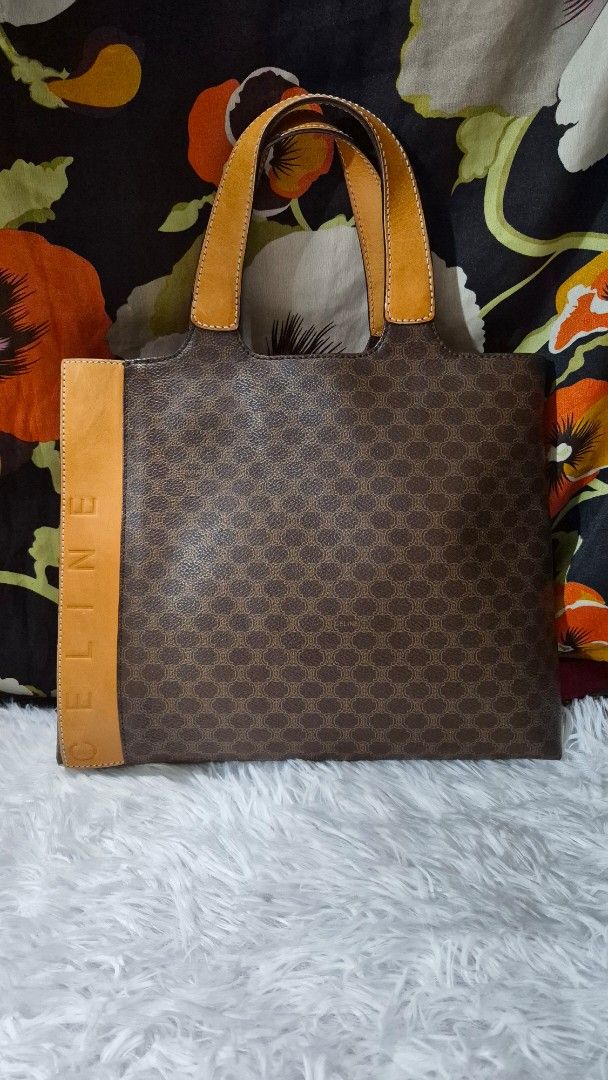 Celine Brown Macadam Monogram Leather Tote Bag (Category: Luxury Bags & Wallets) located in Baguio. Submitted by jhaz_bags (Listing ID 1469934442, Image 1). Description: - Authentic Celine tote in classic brown Macadam monogram coated canvas - Elegant tan leather trim and sturdy dual top handles - Features embossed Celine lettering at the base - Divided interior with a secure center zip compartment - Clean dark brown lining - Perfect everyday siz