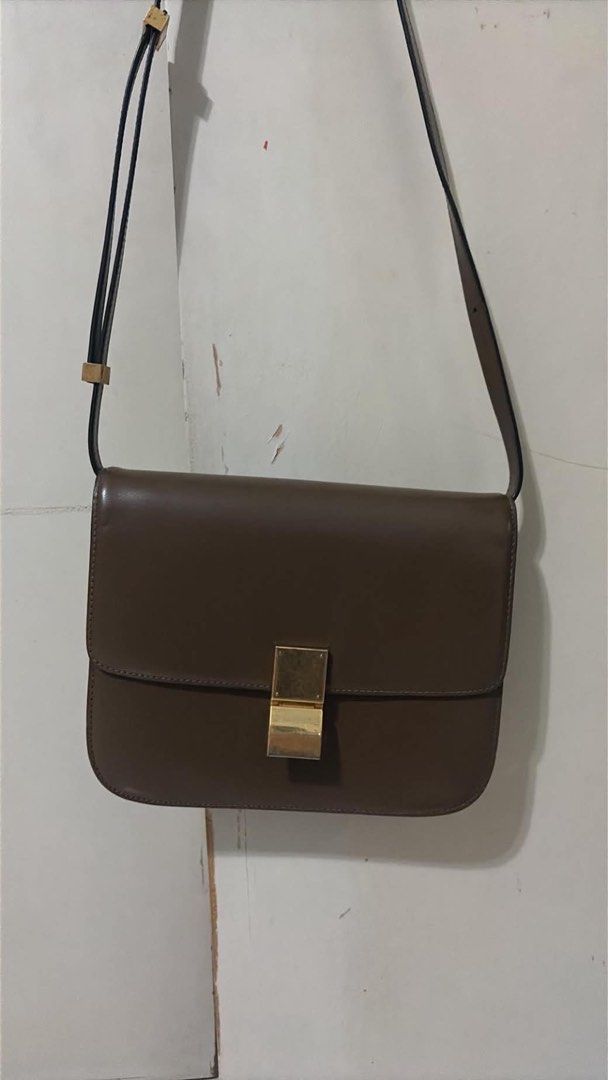 Celine Medium Classic Box Bag Brown Leather (Category: Luxury Bags & Wallets) located in Caloocan City. Submitted by theprelovedpurse (Listing ID 1469881392, Image 1). Description: - Brand: Celine - Style: Classic Box Bag - Color: Brown - Hardware: Gold-tone - Material: Leather with matching leather lining - Features: Structured silhouette, flap closure with metal clasp, adjustable shoulder strap, multiple interior compartments, zipped pocket, sl