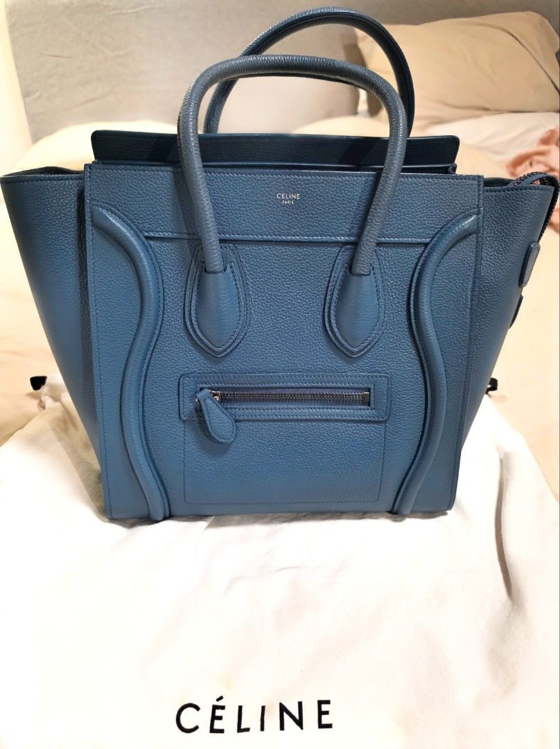 Celine Micro Luggage Tote (Category: Luxury Bags & Wallets) located in Paranaque City. Submitted by decluttering_by_anna (Listing ID 1469930044, Image 1). Description: - Brand: Céline - Style: Micro Luggage Tote - Material: Textured blue leather - Hardware: Silver tone with protective bottom feet - Features: Double rolled top handles, front zipper pocket, structured silhouette - Inclusions: Original Céline branded dust bag, bag organizer and Entr