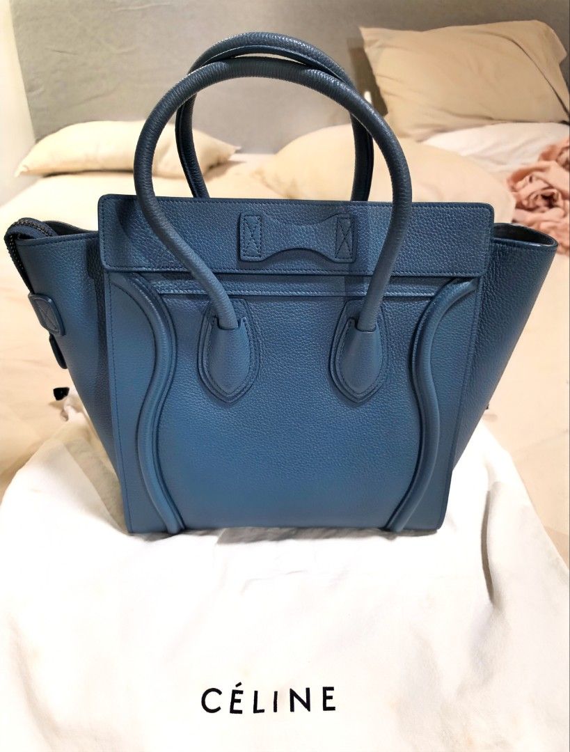 Celine Micro Luggage Tote (Category: Luxury Bags & Wallets) located in Paranaque City. Submitted by decluttering_by_anna (Listing ID 1469930044, Image 2). Description: - Brand: Céline - Style: Micro Luggage Tote - Material: Textured blue leather - Hardware: Silver tone with protective bottom feet - Features: Double rolled top handles, front zipper pocket, structured silhouette - Inclusions: Original Céline branded dust bag, bag organizer and Entr