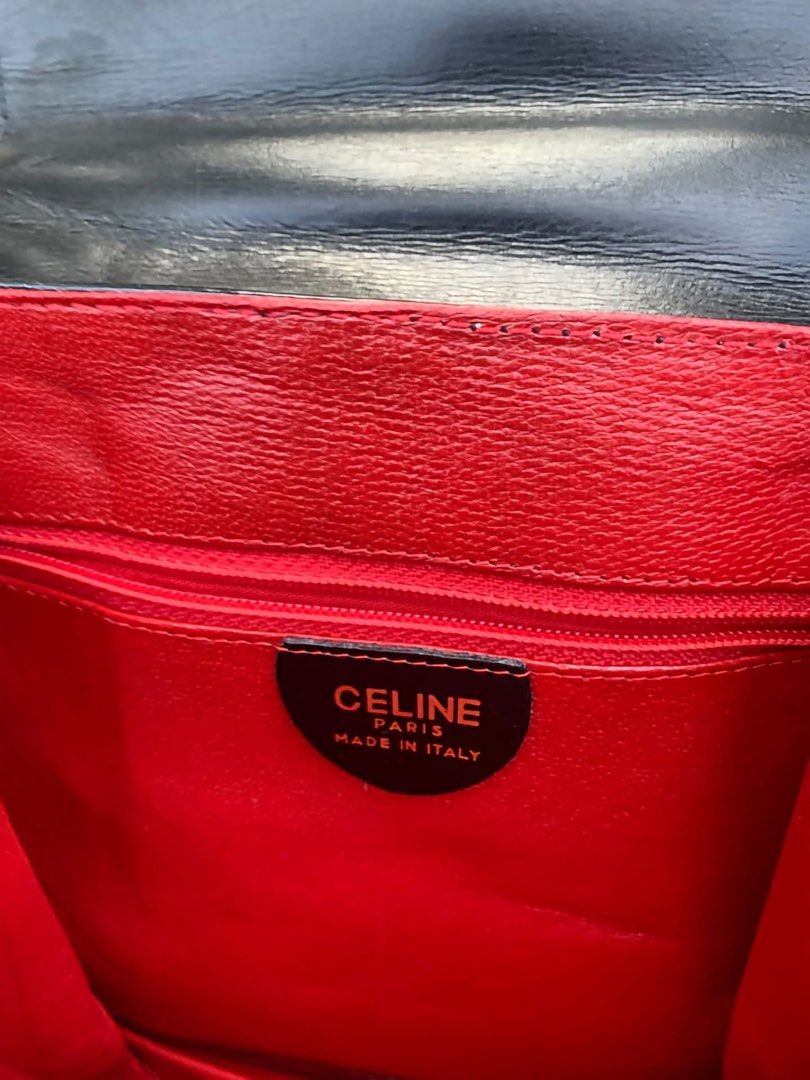 Celine Vintage Black Patent Leather Backpack (Category: Backpacks) located in Iba. Submitted by thriftcoyan (Listing ID 1469807191, Image 3). Description: vintage Black patent leather backpack from Celine. Gold hardware closure engraved with the brand name. Top handle plus shoulder straps. Inside lined in bright red leather with a zippered pocket. Celine Paris Made in Italy leather tag inside with serial code F/05 stamped on the back. - Nandiyan 
