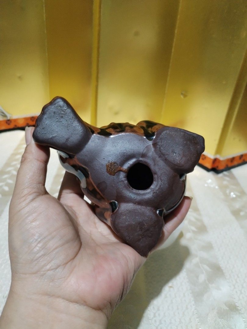 Ceramic frog figurine brown black glazed toad ornament sculpture (Category: Figurines & Statues) located in La Trinidad. Submitted by malditas (Listing ID 1469919655, Image 3). Description: - Brown and black glazed ceramic frog figurine - Detailed texture on the back and head with a heavy glossy finish - Hollow base with three feet underneath - Unique handmade look, perfect for desks or shelves - Great decorative accent for any space From HT box 