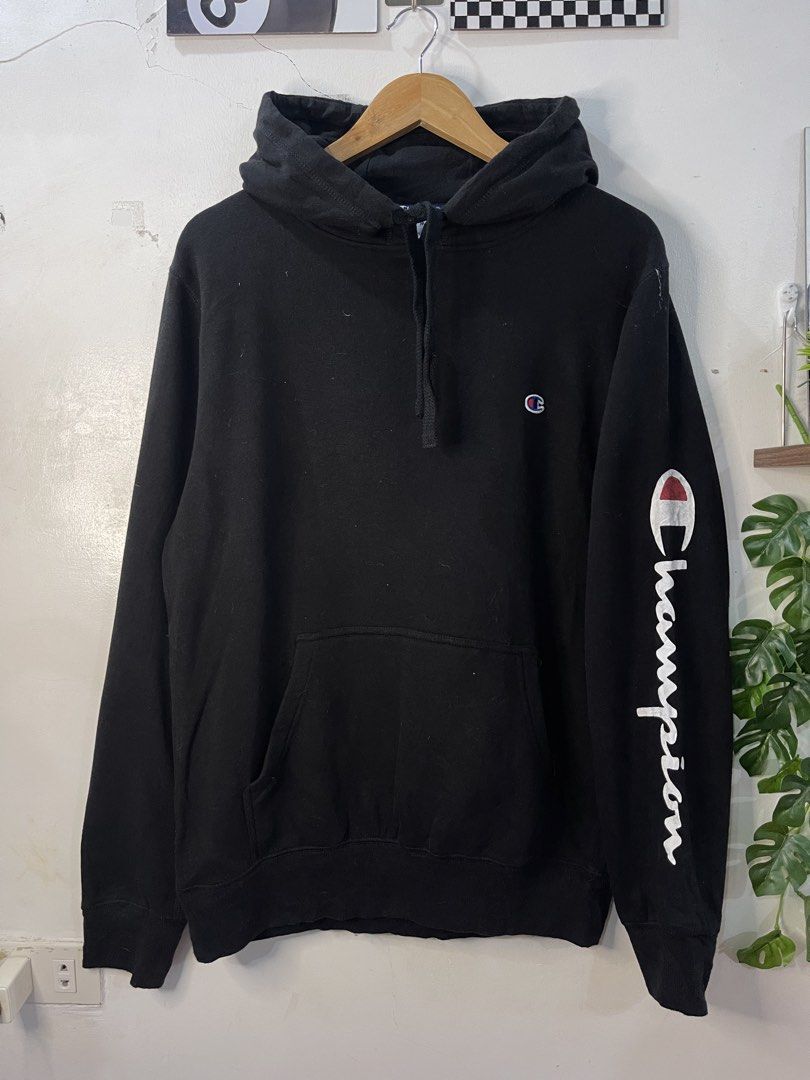 Champion Black Hooded Sweatshirt Size M (Category: Hoodies) located in Cabagan. Submitted by blessingma81004 (Listing ID 1469759310, Image 2). Description: Black Champion hoodie with sleeve branding and embroidered chest logo. Adjustable drawstring hood and front pouch pocket. Cotton and polyester blend material. Tag says size M, fits like extra large with width 22.5 and length 28 inches. Great everyday piece, super warm and comfortable..