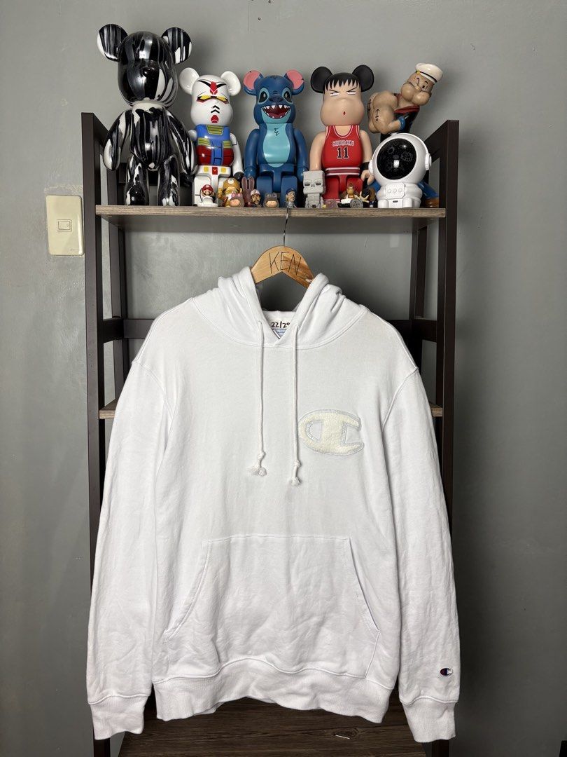 Champion White Hoodie XXLarge (Category: Hoodies) located in Manila. Submitted by thriftnikenv.2 (Listing ID 1469865277, Image 1). Description: - Brand: Champion - Size: XXLarge (2XL) - Color: Classic White - Material: 100% Cotton (Made in Indonesia) - Design: Large chenille C logo patch on the chest - Details: Kangaroo front pocket, drawstring hood, ribbed cuffs, and embroidered sleeve patch - Condition: Excellent, ready to wear.