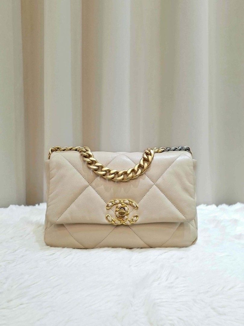 Chanel 19 small (Category: Luxury Bags & Wallets) located in Mandaluyong City. Submitted by chloebuysthings (Listing ID 1469913784, Image 2). Description: - Brand/Model: Chanel 19 Small - Color: Beige - Style: Crossbody / Shoulder bag with signature chunky chain strap and CC turn-lock closure - Inclusions: card, dust bag, box - Condition: Well-maintained - Meetup locations: Nuvali (Santa Rosa, Laguna) or Makati City.