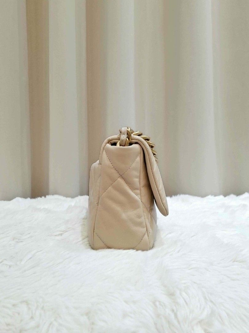 Chanel 19 small (Category: Luxury Bags & Wallets) located in Mandaluyong City. Submitted by chloebuysthings (Listing ID 1469913784, Image 3). Description: - Brand/Model: Chanel 19 Small - Color: Beige - Style: Crossbody / Shoulder bag with signature chunky chain strap and CC turn-lock closure - Inclusions: card, dust bag, box - Condition: Well-maintained - Meetup locations: Nuvali (Santa Rosa, Laguna) or Makati City.