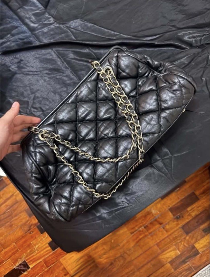 Chanel Quilted Black Leather Chain Shoulder Bag (Category: Luxury Bags & Wallets) located in Manila. Submitted by aerbj (Listing ID 1469849457, Image 2). Description: - Authentic Chanel black quilted leather shoulder bag - Elegant gold-tone hardware and chain straps - Secure top zip closure with structured flat base and metal feet - Black Chanel logo fabric interior lining with a convenient zipper pocket - Crafted in France with classic quilted p