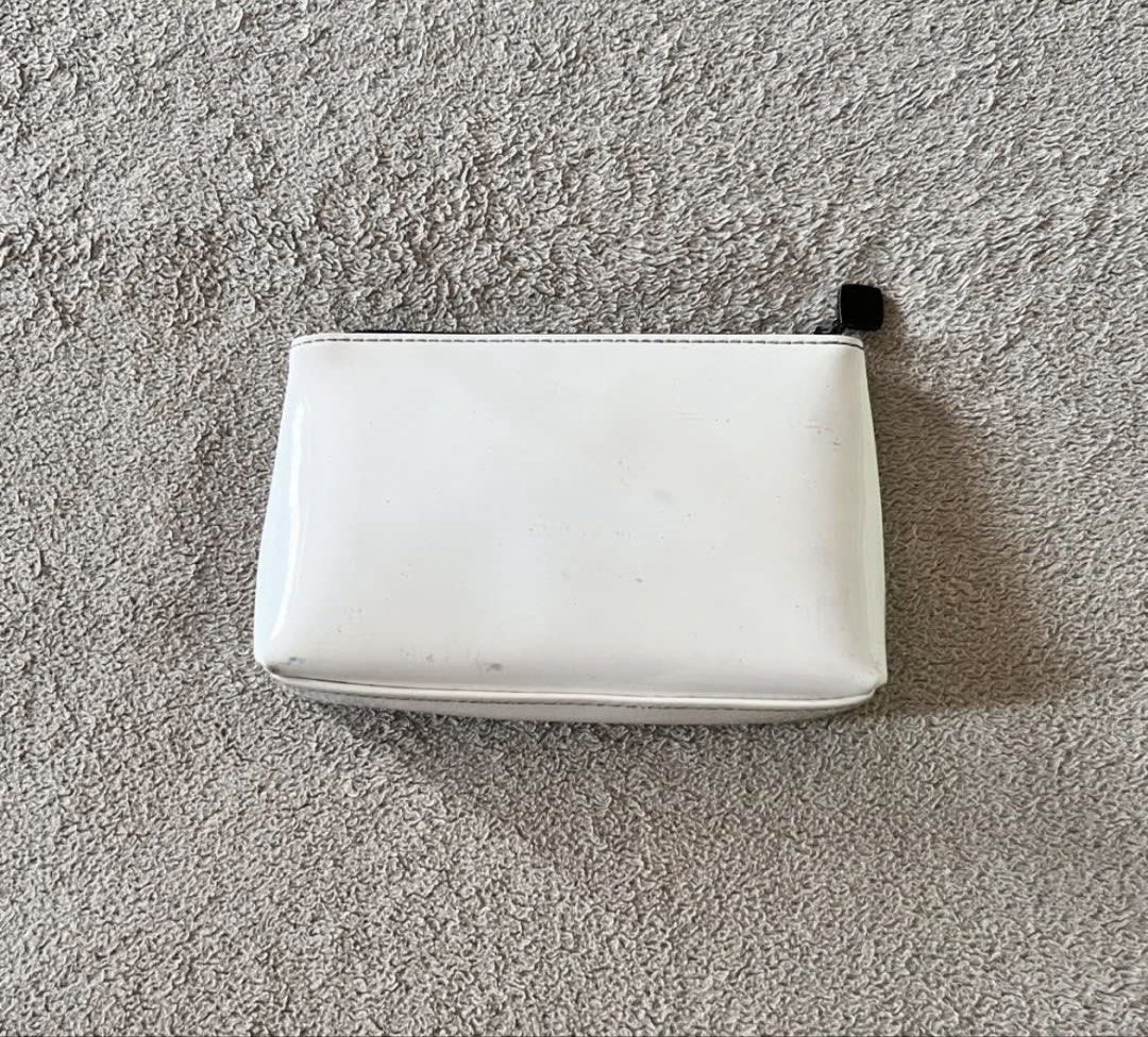 Chanel White Novelty Vinyl Small Pouch (Category: Luxury Bags & Wallets) located in Naga. Submitted by kitty_cate02 (Listing ID 1469806114, Image 2). Description: Preloved with signs of usage Please see pictures for reference Measurements: 16cm x 10cm x 2.4cm Authentic💯.