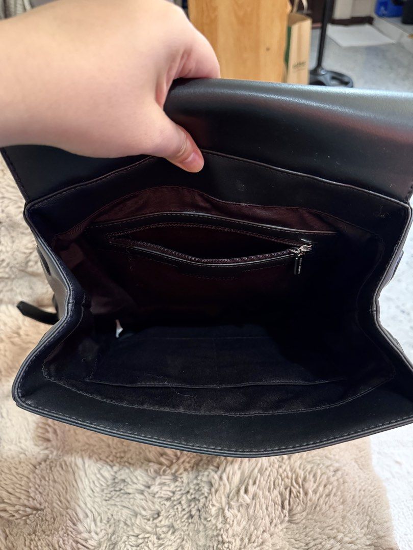 Charles & Keith Octavia Front-Flap Backpack - Noir (Category: Backpacks) located in Pasay City. Submitted by hiyasjewels (Listing ID 1469773220, Image 3). Description: - Brand: Charles & Keith - Model: Octavia Front-Flap Backpack - Color: Classic Black with Silver Hardware - Material: Premium faux leather - Versatility: Top handle and adjustable convertible straps - Closure: Magnetic front flap - Storage: Lined interior with zippered and slip poc