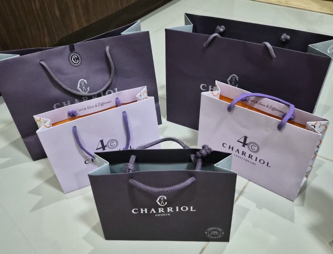 Charriol Paper Bag Take All 6 (Category: Everything Else Others) located in Paranaque City. Submitted by lovelife.312 (Listing ID 1469825098, Image 1). Description: ***PLEASE READ CAREFULLY*** - Authentic Charriol paper bag bundle in assorted sizes - Includes standard dark purple bags and special 40th anniversary light purple bags with vibrant orange interior accents - Perfect for luxury gifting, organizing, or collection - Message us for more de