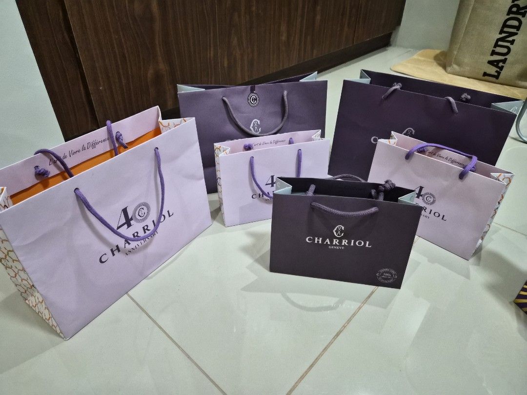 Charriol Paper Bag Take All 6 (Category: Everything Else Others) located in Paranaque City. Submitted by lovelife.312 (Listing ID 1469825098, Image 2). Description: ***PLEASE READ CAREFULLY*** - Authentic Charriol paper bag bundle in assorted sizes - Includes standard dark purple bags and special 40th anniversary light purple bags with vibrant orange interior accents - Perfect for luxury gifting, organizing, or collection - Message us for more de
