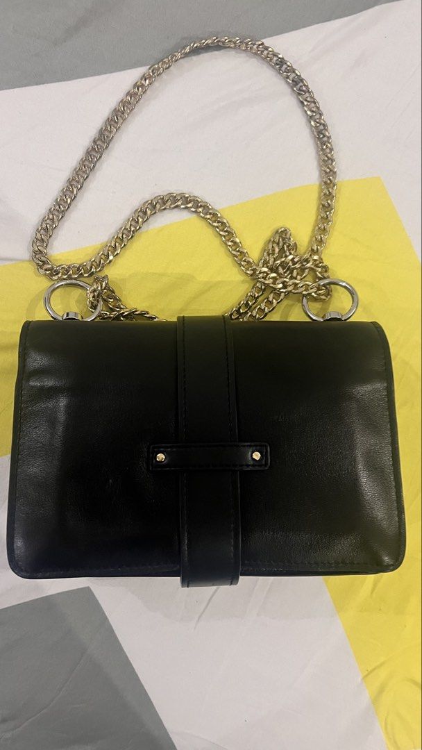 Chloé Aby Chain Shoulder Bag Black (Category: Cross-body Bags) located in Dagupan City. Submitted by pardonmyfrench2025 (Listing ID 1469815643, Image 3). Description: - Brand: Chloé - Material: Premium black leather - Hardware: Gold-tone with chain strap - Closure: Front flap with signature logo padlock and magnetic snap - Interior: Clean black leather lining with zipper compartment and gold hot-stamped logo - Origin: Made in Italy - Condition: V