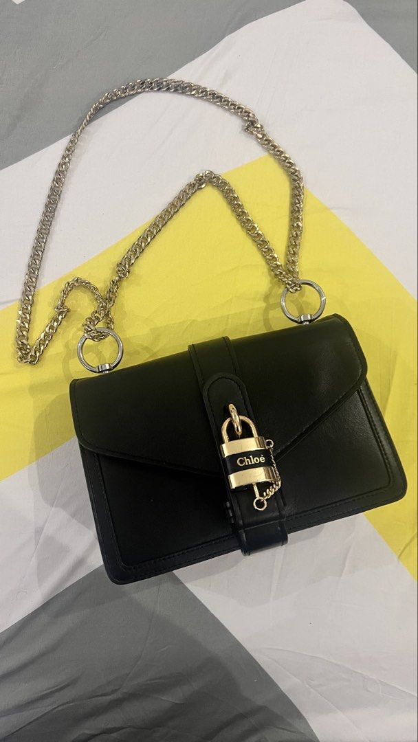 Chloé Aby Chain Shoulder Bag Black (Category: Cross-body Bags) located in Dagupan City. Submitted by pardonmyfrench2025 (Listing ID 1469815643, Image 1). Description: - Brand: Chloé - Material: Premium black leather - Hardware: Gold-tone with chain strap - Closure: Front flap with signature logo padlock and magnetic snap - Interior: Clean black leather lining with zipper compartment and gold hot-stamped logo - Origin: Made in Italy - Condition: V