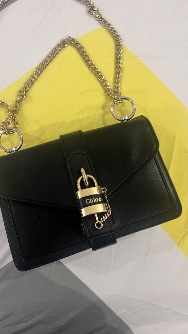 Chloé Aby Chain Shoulder Bag Black (Category: Cross-body Bags) located in Dagupan City. Submitted by pardonmyfrench2025 (Listing ID 1469815643, Image 2). Description: - Brand: Chloé - Material: Premium black leather - Hardware: Gold-tone with chain strap - Closure: Front flap with signature logo padlock and magnetic snap - Interior: Clean black leather lining with zipper compartment and gold hot-stamped logo - Origin: Made in Italy - Condition: V