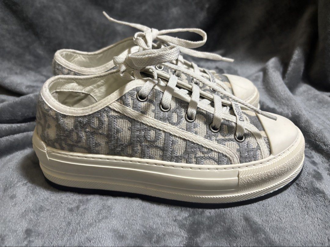 Christian Dior: Walk'n'Dior Platform Sneaker (Category: Sneakers) located in Pasig City. Submitted by jie1031 (Listing ID 1469881748, Image 3). Description: Walk’n’Dior Platform Sneaker Stone Gray Dior Oblique Embroidered Cotton The Walk’n’Dior platform sneaker enhances the line with a modern creation. The stone gray Dior Oblique embroidered cotton upper is complemented by a comfortable thick sole, tongue and Christian Dior Paris laces. The sneak