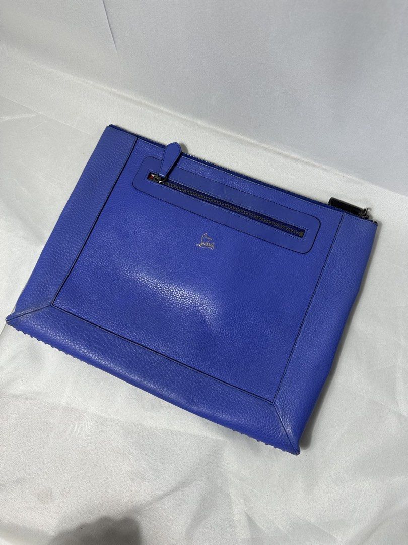 Christian Louboutin Stud Document Bag (Category: Luxury Bags & Wallets) located in Cabanglasan. Submitted by thefashiongarage.co (Listing ID 1469764099, Image 1). Description: Title - Christian Louboutin Model/Name - Stud Document Bag Size on Tag - Medium Conditiion - Excellent Condition eith Corner Rubs Only - Stud are intact and complete Dimension (WxLxH) - 15x12 Inches Category- Casual/Formal Fitting - Made in - Italy Material - Leather Color 