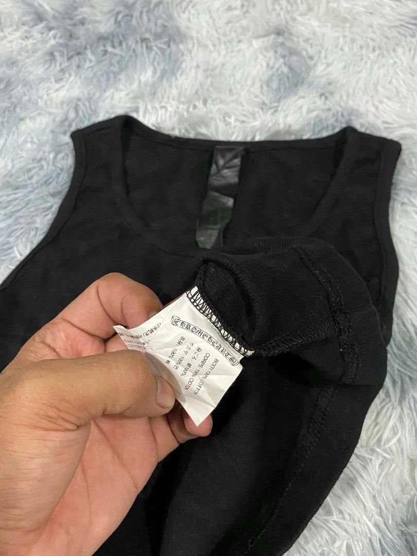 Chrome Hearts Black Ribbed Crop Tank Top (Category: Sleeveless) located in Manila. Submitted by gemfinds650 (Listing ID 1469901754, Image 3). Description: - Brand: Chrome Hearts - Material: soft & stretchy cotton - Design: Black ribbed tank top with white floral dagger logo & gothic lettering - Fit: Cropped length - Details: Signature leather label inside neckline - Condition: Brand new / Excellent quality.