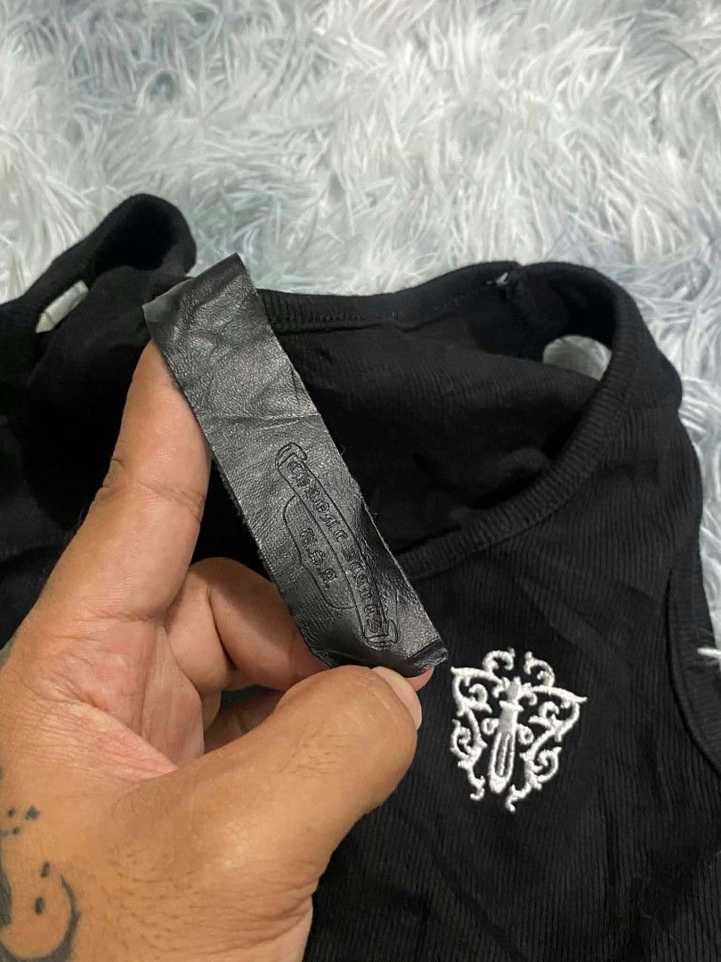 Chrome Hearts Black Ribbed Crop Tank Top (Category: Sleeveless) located in Manila. Submitted by gemfinds650 (Listing ID 1469901754, Image 2). Description: - Brand: Chrome Hearts - Material: soft & stretchy cotton - Design: Black ribbed tank top with white floral dagger logo & gothic lettering - Fit: Cropped length - Details: Signature leather label inside neckline - Condition: Brand new / Excellent quality.