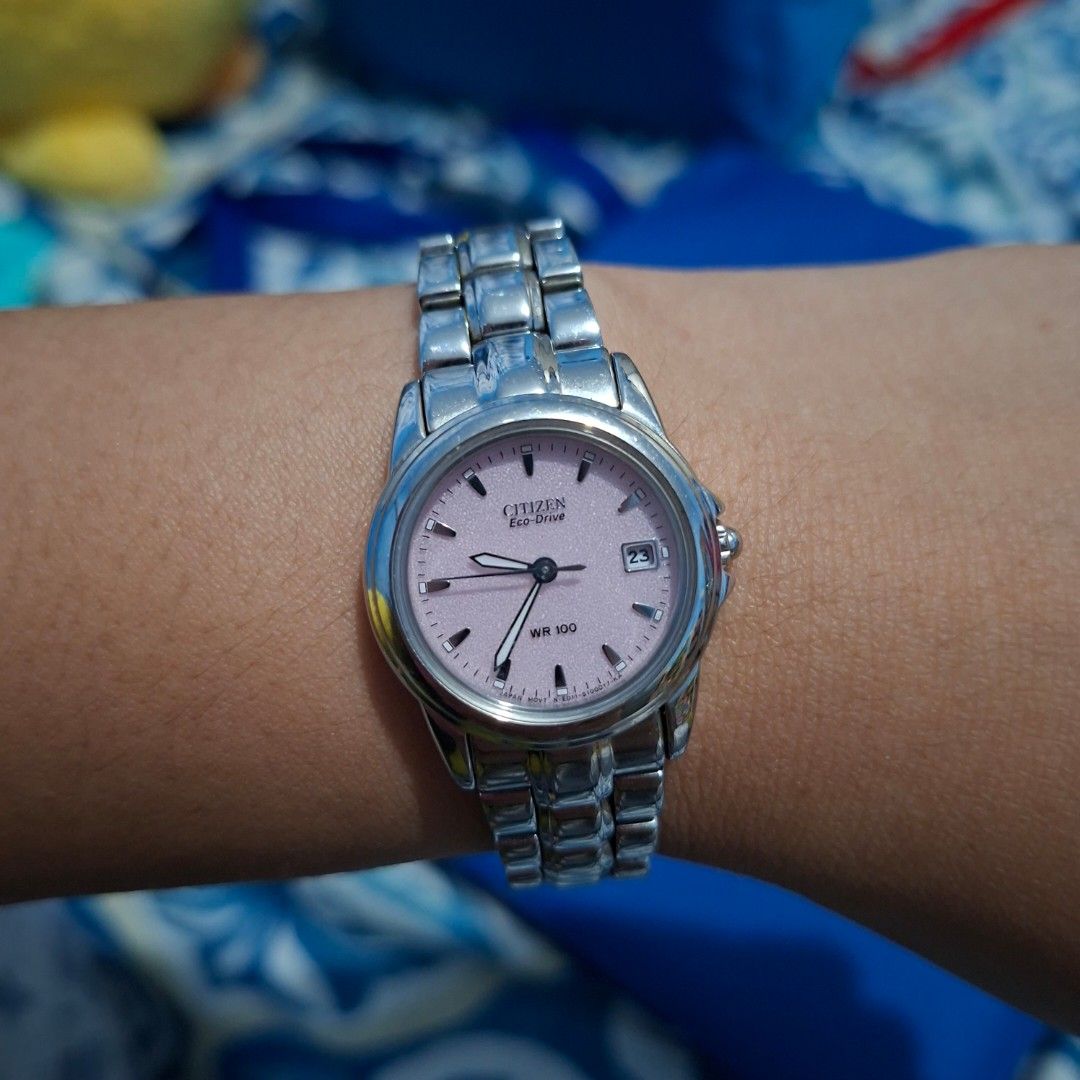 Citizen EcoDrive Pink Dial Luminous Hands (Category: Luxury Watches) located in Cavite. Submitted by sofabinpink (Listing ID 1469892791, Image 2). Description: • Movement: Proprietary Citizen Eco-Drive solar-powered quartz movement that charges using any indoor or outdoor light source. • Dial: Pale pink background featuring silver-tone indices, luminous hands, and a date display window at the 3 o'clock position. • Water Resistance: Rated for WR 1