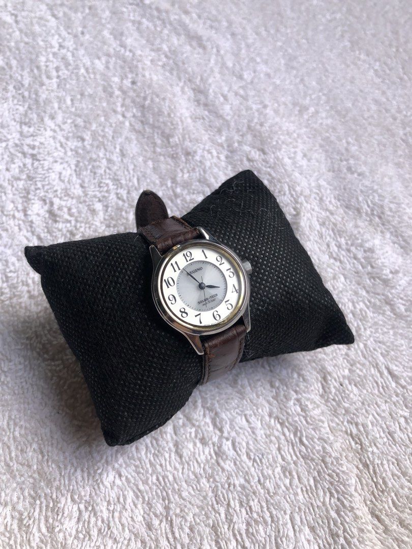 Citizen Reguno Solar-Tech (Category: Women's Watches) located in Dagupan City. Submitted by alex123345 (Listing ID 1469912470, Image 2). Description: Citizen Reguno Solar-Tech Brand: Reguno (Sub-brand of Citizen) Model: Reguno Solar-Tech Ladies Reference: E011-0088591 / E011-H28840 Watch Movement: Citizen Caliber E011 Solar Quartz Power Source: Solar Powered / Light-driven Dial Details: White Textured Dial with Arabic Numerals, Leaf-style Hands C