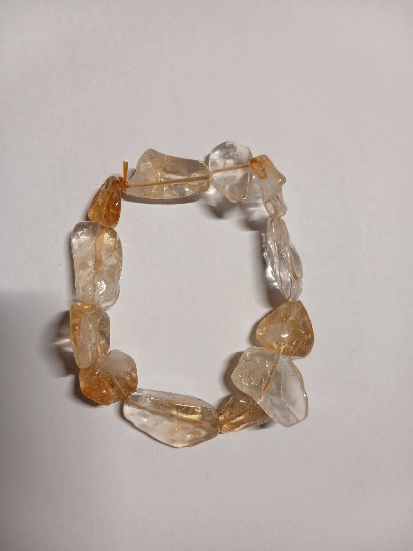 Citrine Bracelet (Category: Bracelets) located in Manila. Submitted by thecollectibleshop (Listing ID 1469819994, Image 2). Description: Selling an irregular free form crystal chip Cittinw bracelet. It will fit regular hand and string is adjustable. Buyer pays for the shipping fee..