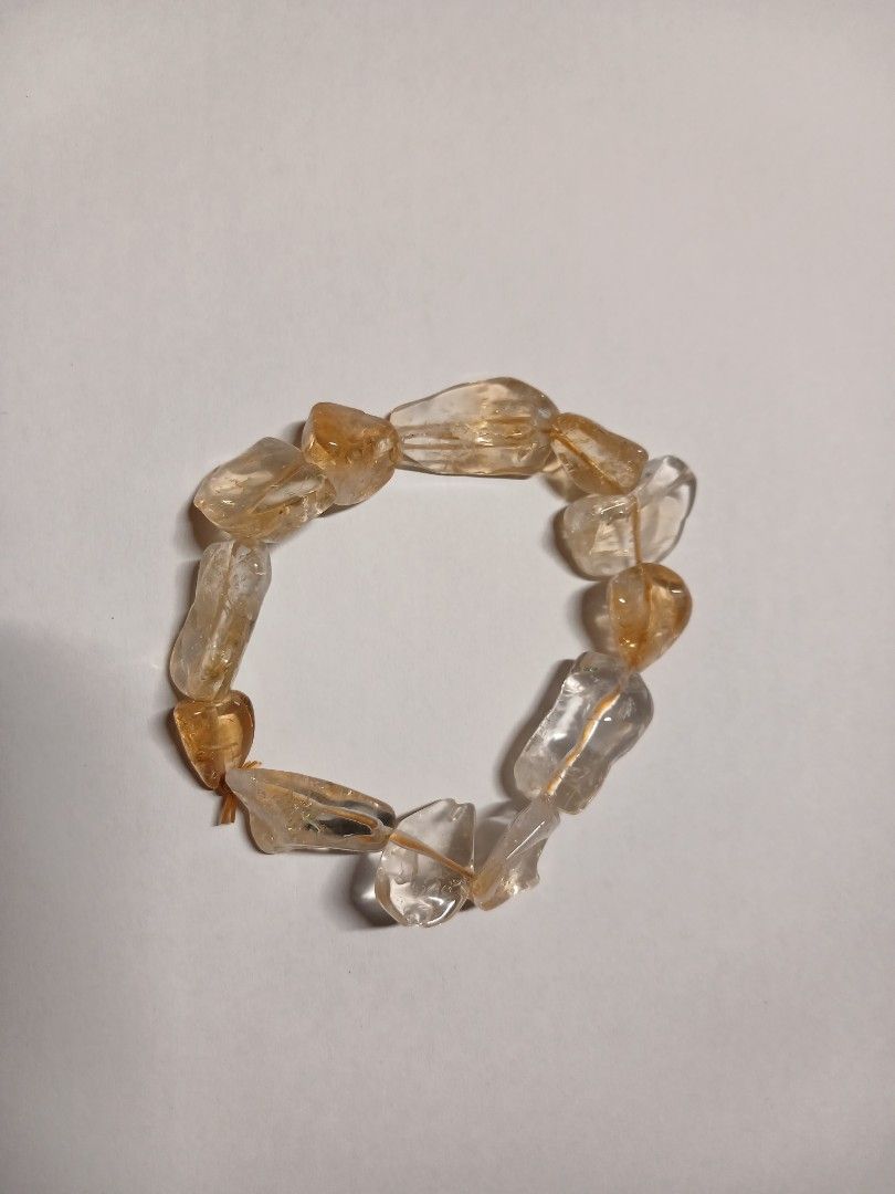 Citrine Bracelet (Category: Bracelets) located in Manila. Submitted by thecollectibleshop (Listing ID 1469819994, Image 1). Description: Selling an irregular free form crystal chip Cittinw bracelet. It will fit regular hand and string is adjustable. Buyer pays for the shipping fee..