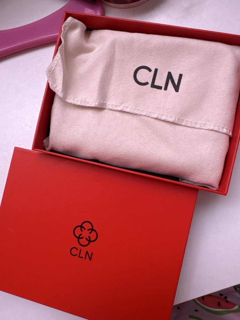 CLN Monogram Passport Holder (Category: Luxury Bags & Wallets) located in San Fernando. Submitted by camilla3000 (Listing ID 1469780960, Image 3). Description: - White and grey monogram print with white interior - Equipped with multiple card slots and a handy slip pocket - Comes complete with original red box and dust bag - Perfect for stylish travels or as a gift.