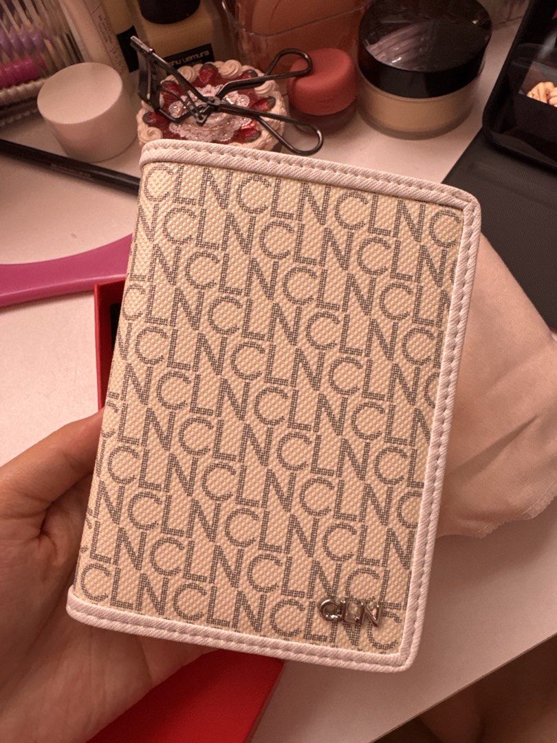 CLN Monogram Passport Holder (Category: Luxury Bags & Wallets) located in San Fernando. Submitted by camilla3000 (Listing ID 1469780960, Image 1). Description: - White and grey monogram print with white interior - Equipped with multiple card slots and a handy slip pocket - Comes complete with original red box and dust bag - Perfect for stylish travels or as a gift.