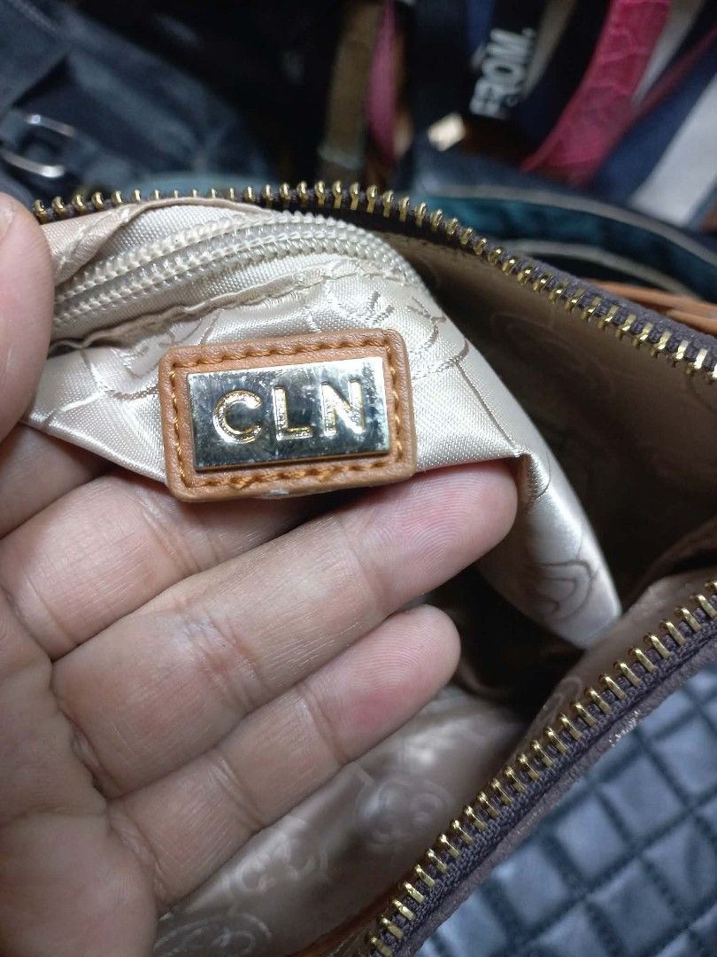 SOLD CLN Monogram Shoulder Bag Brown Tan (Category: Luxury Bags & Wallets) located in Manila. Submitted by dei03_diz (Listing ID 1469811341, Image 3). Description: - Brand: CLN - Design: Brown monogram print with tan leather-look trim - Strap: Adjustable - Closure: Zip top - Interior: Satin lining with inner zip pocket and brand plaque - Condition: Clean inside and out - Usage: Handy daily bag normal signs of usage in CLN .