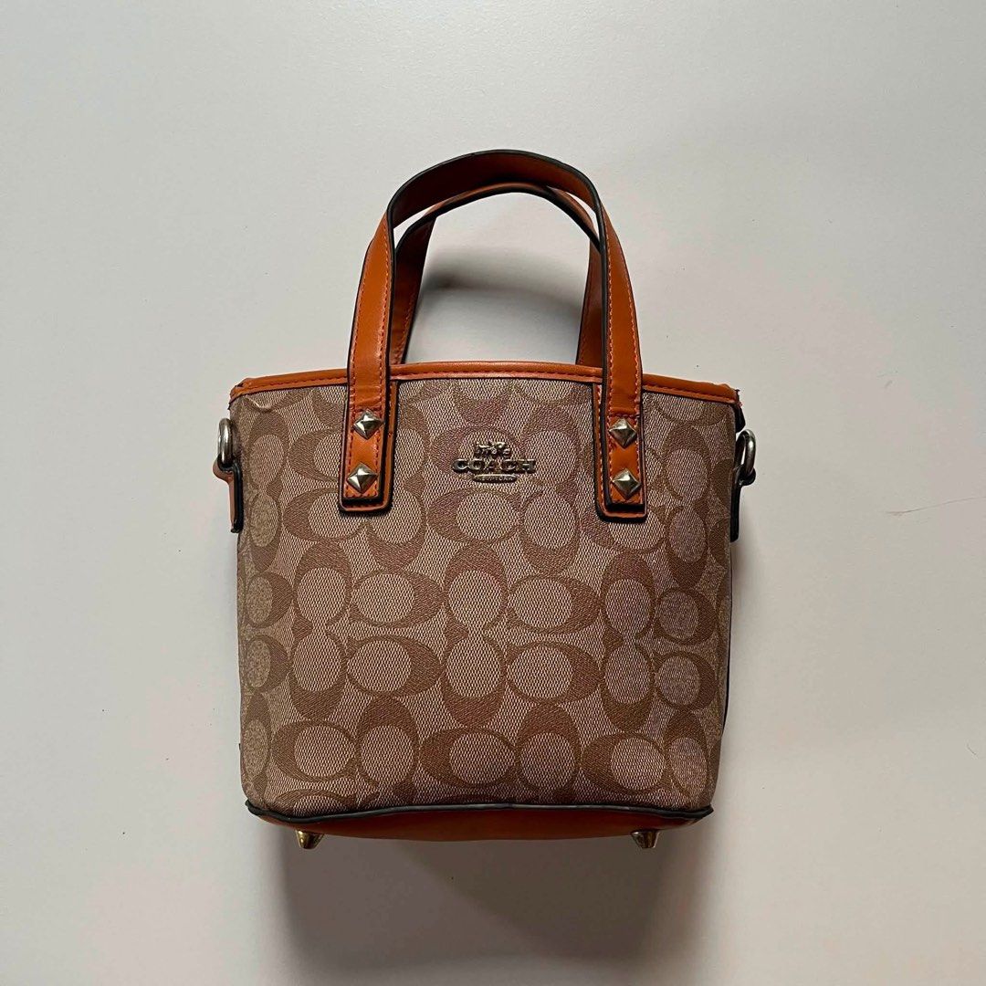 Coach canvas mini tote bag (Category: Luxury Bags & Wallets) located in Manila. Submitted by fiercetree_a910ea (Listing ID 1469935394, Image 1). Description: 👜 Coach canvas mini tote bag 🤎 Pre-loved | Thrifted Selling my Coach canvas mini tote bag. Bag only, no strap. Pre-loved and sourced from a thrifted store. Please note that authenticity is not guaranteed, so kindly manage expectations before purchasing. 📩 Message me for more photos, video