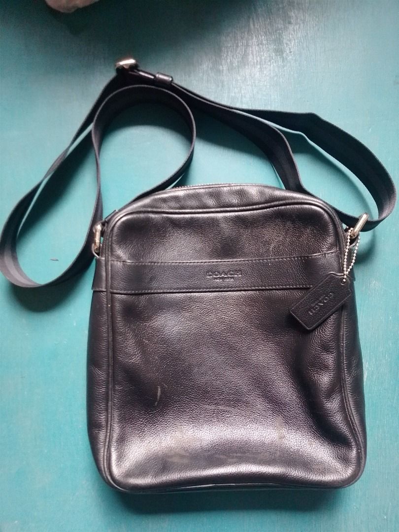 Coach Leather Crossbody Bag Black (Category: Cross-body Bags) located in Caloocan City. Submitted by hmm_shop83 (Listing ID 1469828910, Image 1). Description: - Brand: Coach - Material: Black leather with fabric lining and adjustable fabric strap - Closure & Hardware: Zipper closure with silver-tone hardware - Pockets: Convenient front slip pocket and interior snap pocket - Details: Includes signature Coach creed patch and original hangtag - Cond