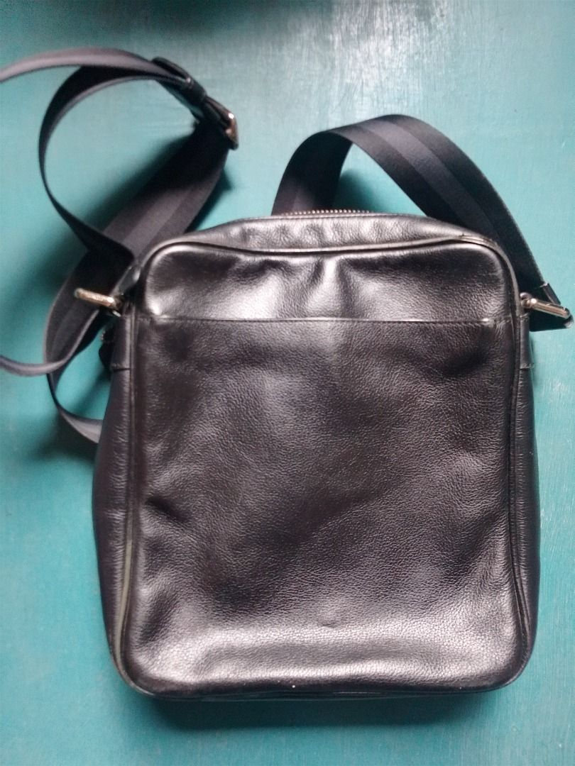 Coach Leather Crossbody Bag Black (Category: Cross-body Bags) located in Caloocan City. Submitted by hmm_shop83 (Listing ID 1469828910, Image 2). Description: - Brand: Coach - Material: Black leather with fabric lining and adjustable fabric strap - Closure & Hardware: Zipper closure with silver-tone hardware - Pockets: Convenient front slip pocket and interior snap pocket - Details: Includes signature Coach creed patch and original hangtag - Cond