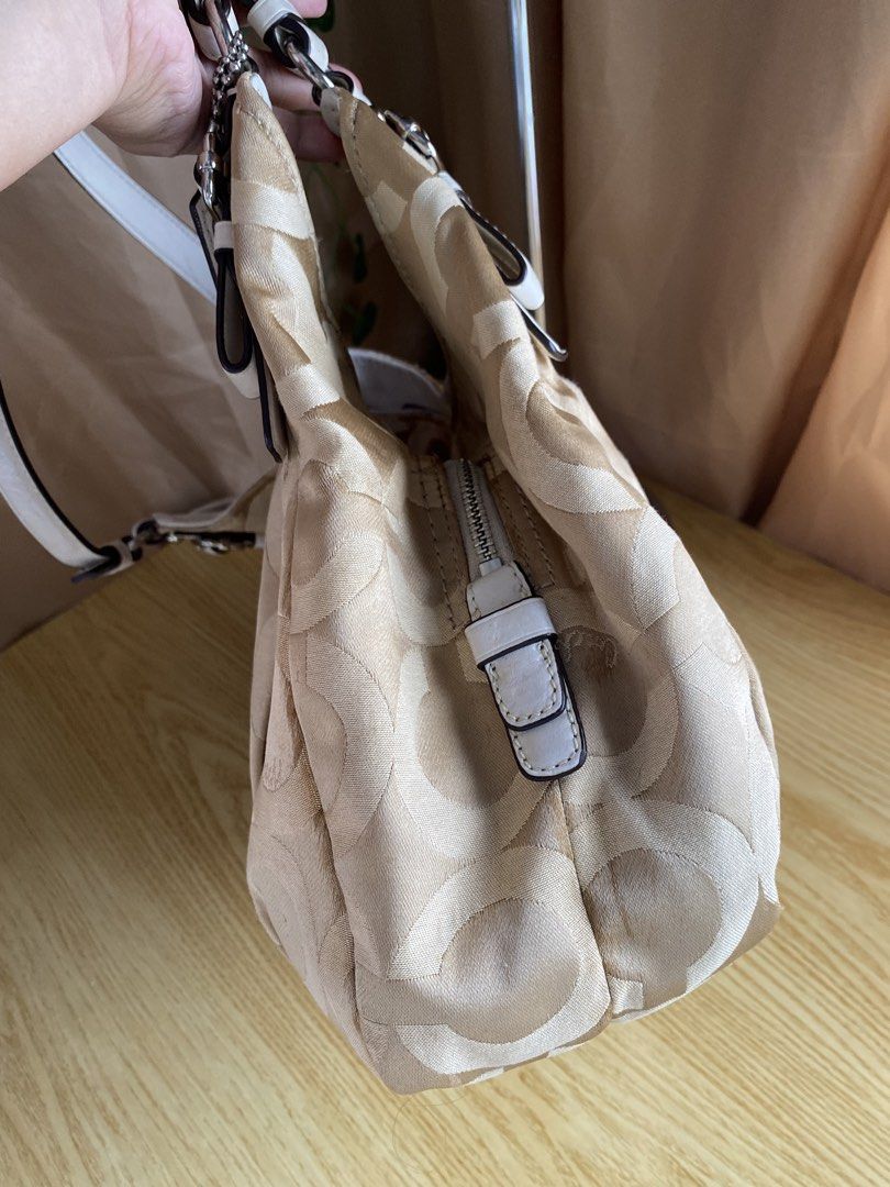 Coach Madison Hobo Bag (Category: Luxury Bags & Wallets) located in Bulacan. Submitted by red.basket24 (Listing ID 1469789174, Image 3). Description: ‼️AVAILABLE‼️Coach Madison Hobo Bag 🏷️Mine:3,200 php 📌Size: Medium 📌Condition: Good Condition 🌸YKK Zip 🌸Present Creed and Hangtag 🌸no runs/rubs 🌸Silver hardwares Flaw/s: ‼️dirt in canvas material, scuffing in handle NOTE: 📌Display accessories are not included and for photoshoot purposes only