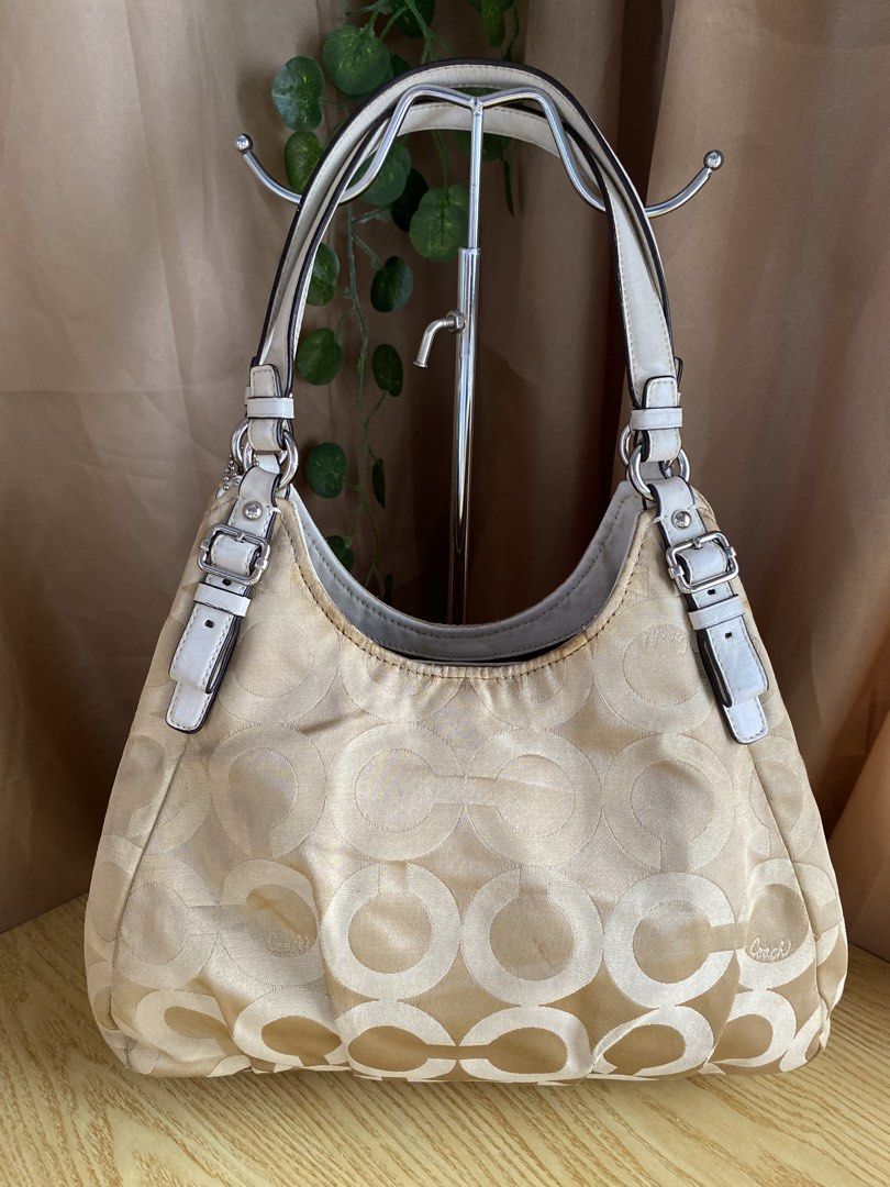Coach Madison Hobo Bag (Category: Luxury Bags & Wallets) located in Bulacan. Submitted by red.basket24 (Listing ID 1469789174, Image 2). Description: ‼️AVAILABLE‼️Coach Madison Hobo Bag 🏷️Mine:3,200 php 📌Size: Medium 📌Condition: Good Condition 🌸YKK Zip 🌸Present Creed and Hangtag 🌸no runs/rubs 🌸Silver hardwares Flaw/s: ‼️dirt in canvas material, scuffing in handle NOTE: 📌Display accessories are not included and for photoshoot purposes only