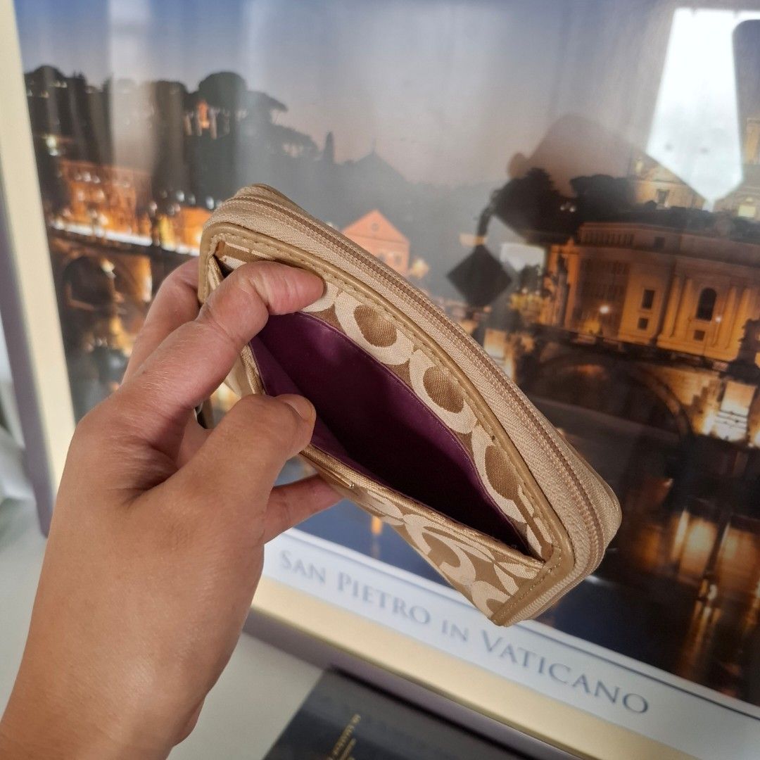 Coach Medium Zippy Wristlet (Free SF) (Category: Luxury Bags & Wallets) located in Baguio. Submitted by bycharmaebuys (Listing ID 1469782920, Image 3). Description: Brand: Coach Guaranteed Authentic 💯 ‼️ SALE PRICE: 1500.00, FREE SHIPPING NATIONWIDE‼️ First to pay basis Zip around, Medium size, wristlet wallet Dimension: 14 cm x 8.5 cm Signature "C" design Signature canvas with Leather trimming Material Khaki color w/ dark purple interior, gold 