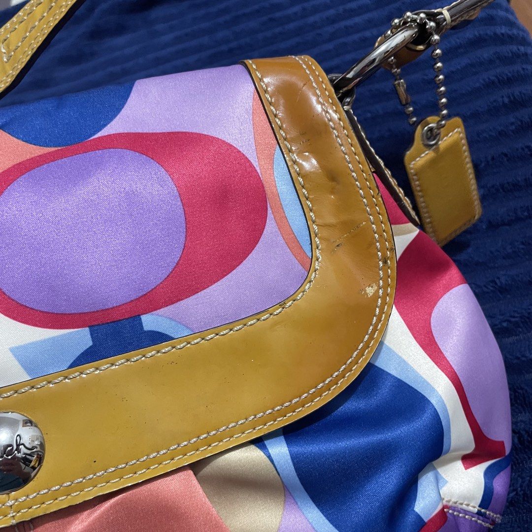 Coach Multicolor Soho (Category: Luxury Bags & Wallets) located in Manila. Submitted by thegoodandthebag (Listing ID 1469921686, Image 3). Description: Coach Multicolor Soho 🔖 ₱6,800 + SF • Lightly Used • Guaranteed Authentic • Slightly Nego • See photos for flaws • NO REFUND/NO RETURN/NO EXCHANGE Note: Please manage your expectations as this is a preloved and vintage piece. *Actual color may vary due to lighting* PM for inquiries! 📩 Follow us 