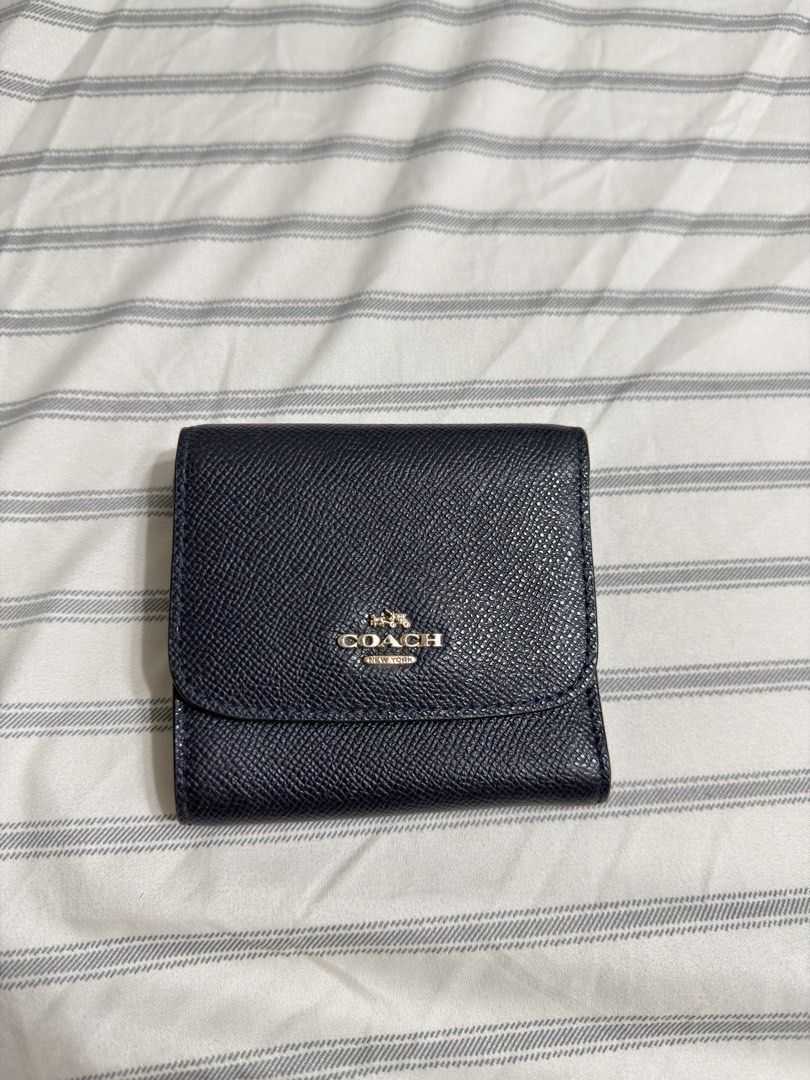 Coach Navy Blue Leather Trifold Wallet (Category: Luxury Bags & Wallets) located in Angeles City. Submitted by kaydee_ (Listing ID 1469903813, Image 1). Description: Selling my authentic Coach Small Trifold Wallet in a classic dark navy blue color with gold-toned hardware.(Needs Interior Touch-Up / DIY Project) 📌 PLEASE READ CONDITION DETAILS BEFORE BUYING (X sensi): -Exterior: The outer crossgrain leather and the front gold Coach horse & carria