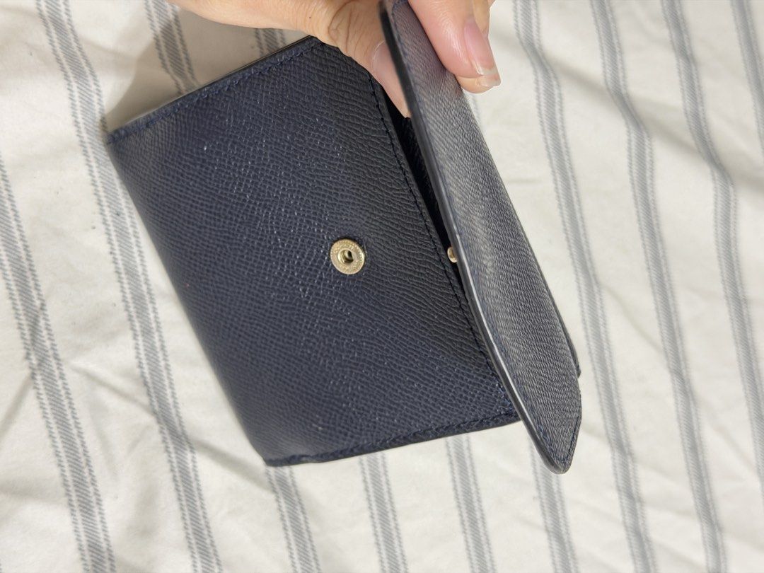 Coach Navy Blue Leather Trifold Wallet (Category: Luxury Bags & Wallets) located in Angeles City. Submitted by kaydee_ (Listing ID 1469903813, Image 3). Description: Selling my authentic Coach Small Trifold Wallet in a classic dark navy blue color with gold-toned hardware.(Needs Interior Touch-Up / DIY Project) 📌 PLEASE READ CONDITION DETAILS BEFORE BUYING (X sensi): -Exterior: The outer crossgrain leather and the front gold Coach horse & carria