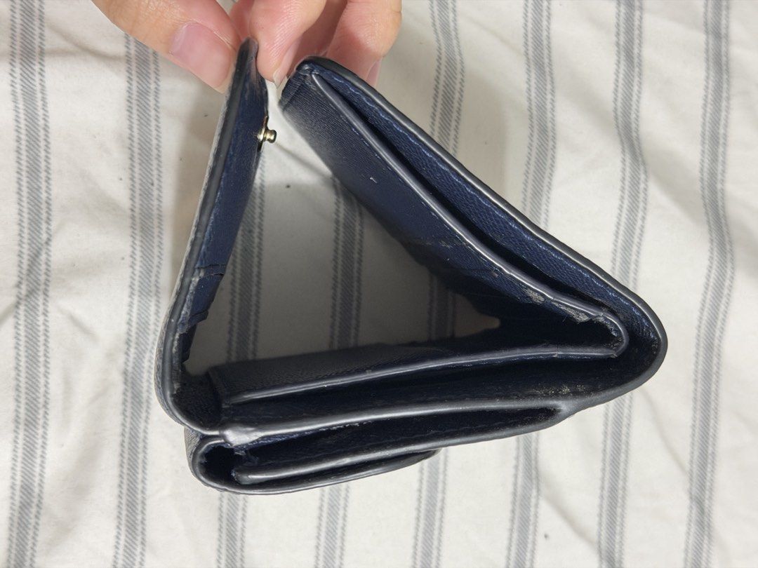 Coach Navy Blue Leather Trifold Wallet (Category: Luxury Bags & Wallets) located in Angeles City. Submitted by kaydee_ (Listing ID 1469903813, Image 2). Description: Selling my authentic Coach Small Trifold Wallet in a classic dark navy blue color with gold-toned hardware.(Needs Interior Touch-Up / DIY Project) 📌 PLEASE READ CONDITION DETAILS BEFORE BUYING (X sensi): -Exterior: The outer crossgrain leather and the front gold Coach horse & carria