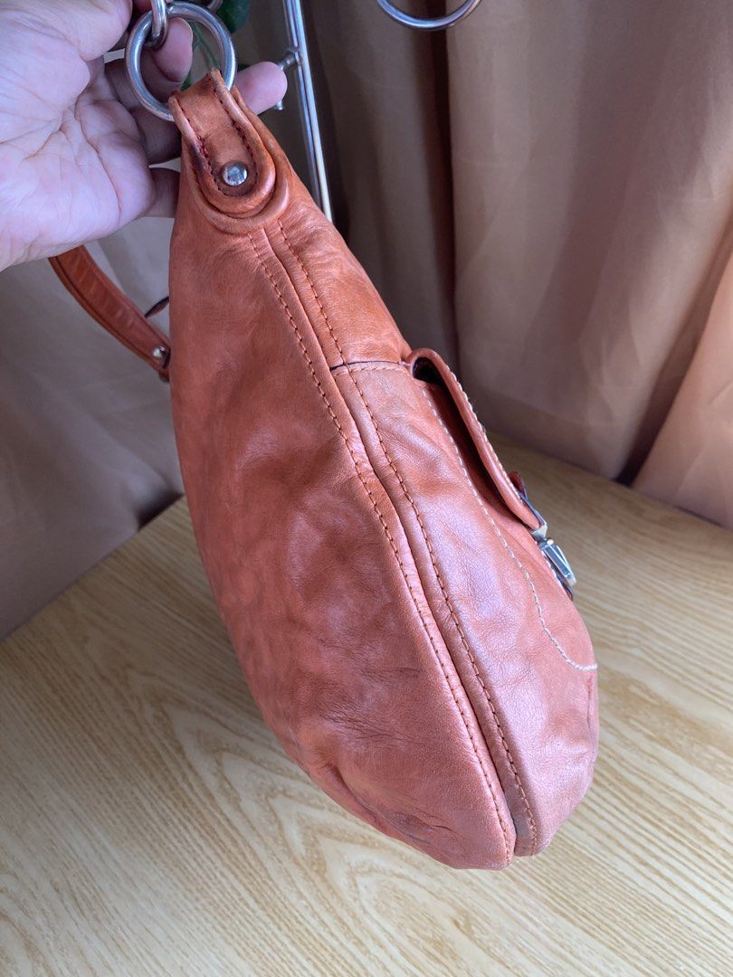 Coach orange leather hobo shoulder bag with front pockets (Category: Luxury Bags & Wallets) located in Bulacan. Submitted by red.basket24 (Listing ID 1469788317, Image 3). Description: ❣️AVAILABLE❣️Coach Poppy Leather 2way 🏷️Mine: 1,800 php 📌Size: Medium 📌Condition: Well Used 🌸YKK Zip 🌸Present Creed and Hangtag 🌸Silver hardwares Flaw/s: ‼️dryness of leather NOTE: 📌Display accessories are not included and for photoshoot purposes only 📌Colo