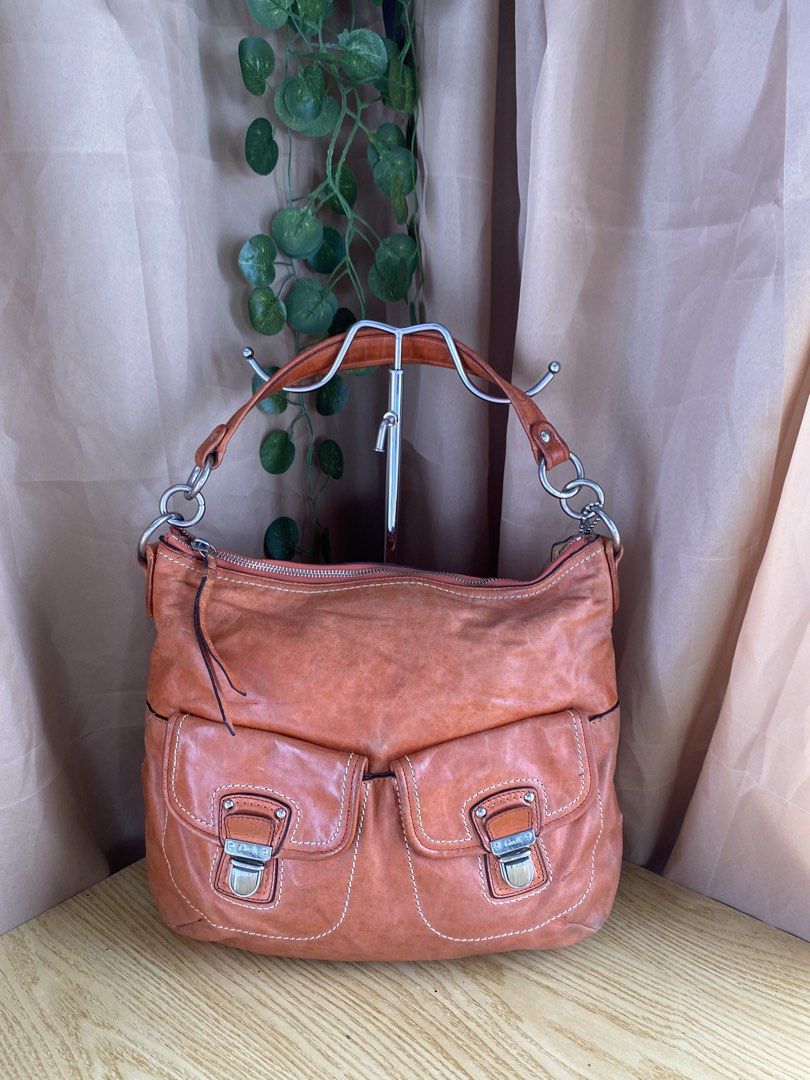 Coach orange leather hobo shoulder bag with front pockets (Category: Luxury Bags & Wallets) located in Bulacan. Submitted by red.basket24 (Listing ID 1469788317, Image 1). Description: ❣️AVAILABLE❣️Coach Poppy Leather 2way 🏷️Mine: 1,800 php 📌Size: Medium 📌Condition: Well Used 🌸YKK Zip 🌸Present Creed and Hangtag 🌸Silver hardwares Flaw/s: ‼️dryness of leather NOTE: 📌Display accessories are not included and for photoshoot purposes only 📌Colo