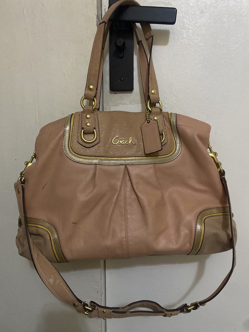 Coach Pink Leather Shoulder Bag (Category: Luxury Bags & Wallets) located in Manila. Submitted by newkkmora98454 (Listing ID 1469894837, Image 1). Description: - Authentic Coach leather shoulder bag in a gorgeous dusty pink shade - Elegant gold-tone hardware accents and gold foil script logo - Dual top handles plus a convenient detachable crossbody strap - Front flap pocket with metallic trim and stylish gathered pleating at the base - Includes s