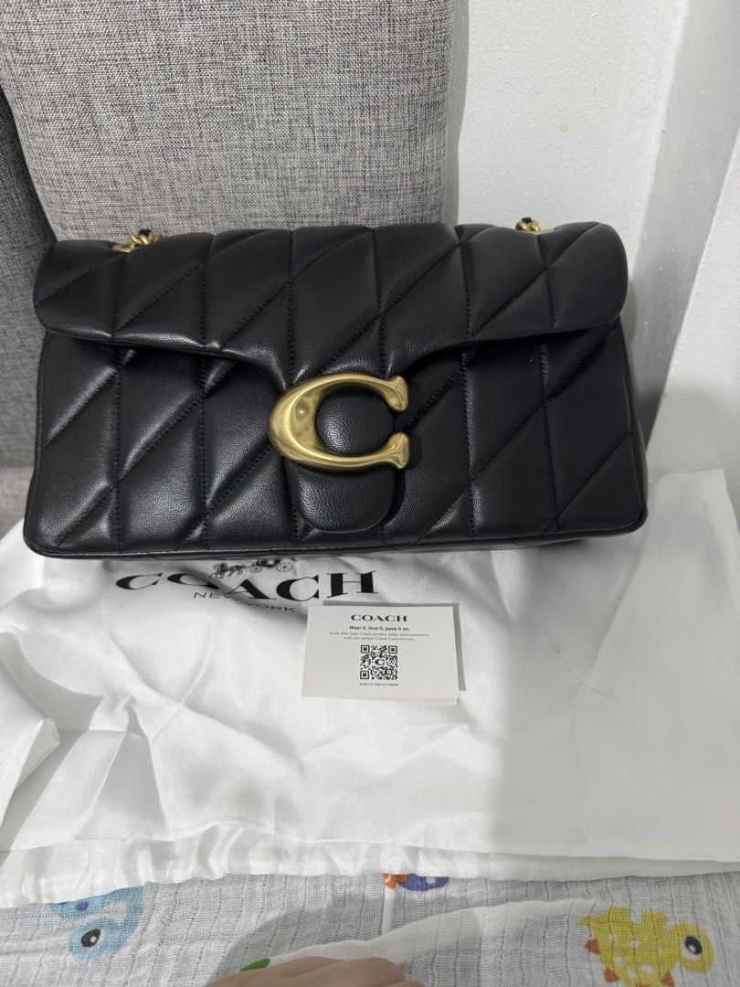 Coach Quilted Tabby Shoulder Bag Black Brass (Category: Luxury Bags & Wallets) located in Marikina City. Submitted by bangsfrancisco (Listing ID 1469798241, Image 1). Description: - Brand: Coach - Color: Black - Material: Quilted leather - Hardware: Antique brass C logo - Design: Puffy diamond-quilted pattern with chain strap details - Inclusions: White dust bag and care card.