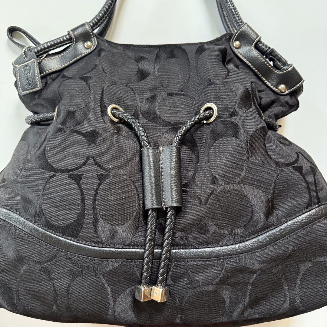 Coach signature black shoulder y2k (Category: Shoulder Bags) located in Cavite. Submitted by kalebfindsluxs (Listing ID 1469895392, Image 3). Description: Coach signature black shoulder y2k Good Sign of usage Check details - 2k + sf Loc cavite Jnt / lalamove .