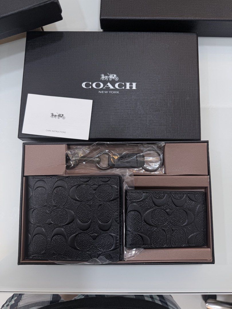 Coach Wallet and Keychain Gift Set (Category: Wallets & Card holders) located in Quezon City. Submitted by nichole12 (Listing ID 1469908123, Image 1). Description: - Brand new Coach gift set (Wallet, Card Holder & Keyring) - Premium embossed black leather with signature monogram pattern - Includes original Coach presentation box and care card - Ideal for gifting or personal everyday use - 100% authentic and ready to ship.